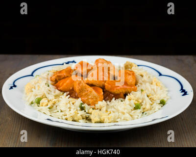 Sweet and Sour Chicken With Egg Fried Rice Chinese Meal Stock Photo