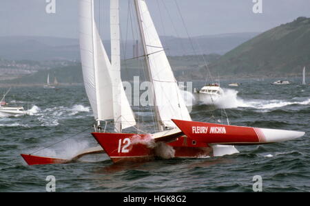AJAXNETPHOTO. 2ND JUNE, 1984. PLYMOUTH, ENGLAND. - OSTAR 1984 - TRIMARAN FLEURY MICHON (FR) SKIPPERED BY PHILIPPE POUPON AT THE START.   PHOTO:ADRIAN MORGAN/AJAX  REF:843326 9 Stock Photo