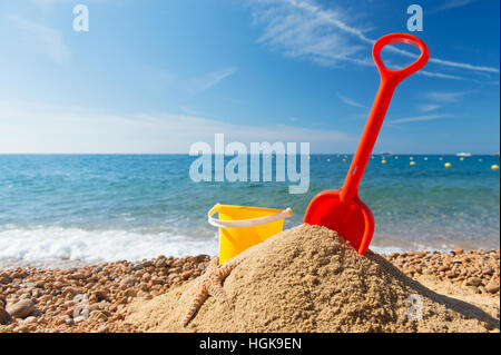Family vacation with toys in the sand Stock Photo