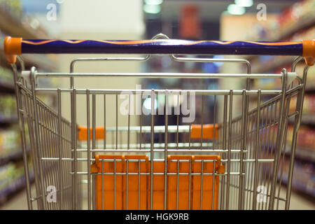 Abstract blurred photo of shopping cart/trolley in the shop Stock Photo