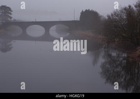 Road bridge over the river Tywi / Towy at Carmarthen / Caerfyrddin on a foggy morning Stock Photo