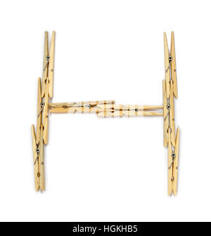 Letter H made of wooden clothespins isolated on white Stock Photo