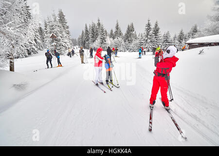 Jakuszyce, Poland - January 06, 2017: Cross-country skiers resting on trails intersection. Stock Photo