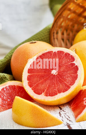 Fresh red grapefruit on white rustic wooden background. Copy space Stock Photo