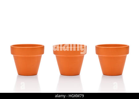 Three terracotta flower pots isolated on white Stock Photo