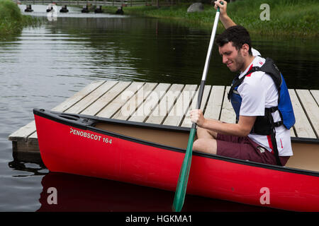 A man canoeing in Kejimkujik National Park and National Historic Site in Nova Scotia, Canada. Stock Photo