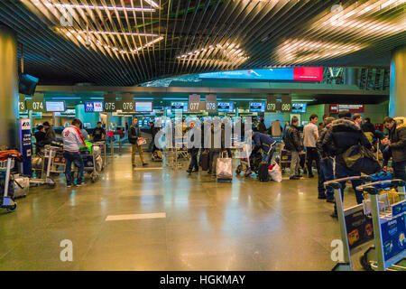 MOSCOW, RUSSIA - DECEMBER 25, 2016:  Passengers stand at the front Desk and baggage airport Vnukovo Stock Photo