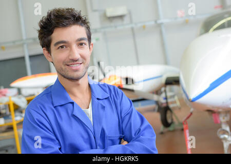 young avionics worker posing Stock Photo
