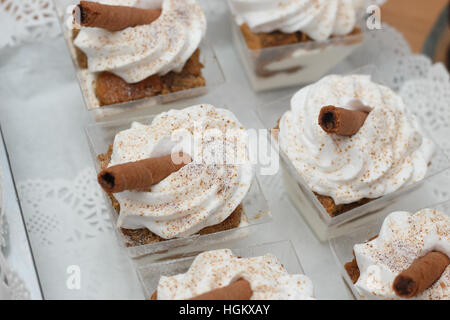 Chocolate rolls dessert with whipped cream shot in artificial light Stock Photo