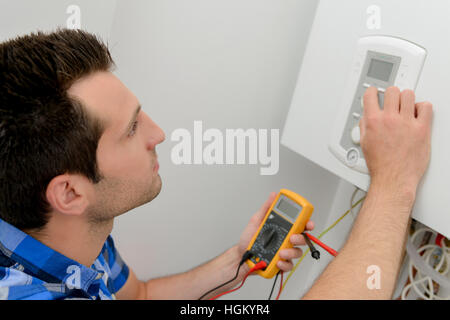 Fixing a boiler system Stock Photo