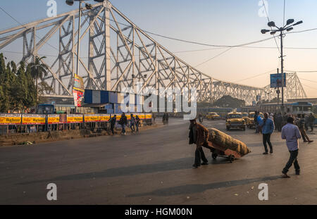 City road traffic near Howrah bridge on a foggy morning. Photograph taken on the road close to Howrah Railway Station, Kolkata. Stock Photo