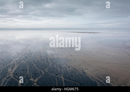 Moody atmospheric  scene on Aberavon beach, South Wales, UK, looking from land out to sea. Stock Photo