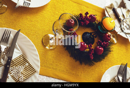 Candle on table, prepared for New Year's Eve. Stock Photo