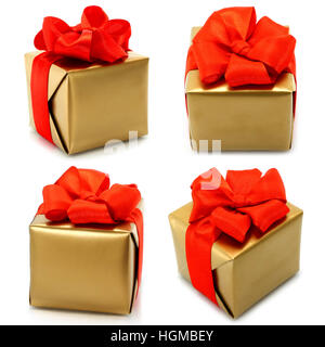 Set of golden gifts with red bow on white background Stock Photo