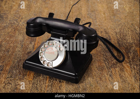 Black Old phone on wood background Stock Photo