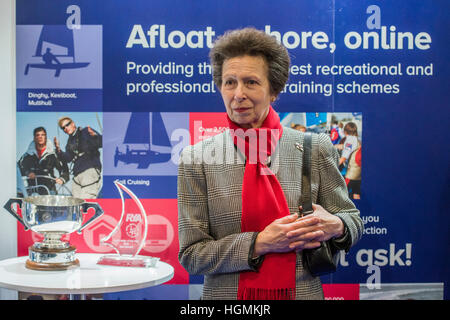 London, UK. 11th January 2017. Princess anne on the RYA stand to give the Yachtmaster of the Year award to Zara Roberts, aged 30 - HRH The Princess Royal, Princess Anne, And her husband Vic Admiral Tim Laurence, tour the London Boat Show 2017 at the Excel Centre. Credit: Guy Bell/Alamy Live News Stock Photo