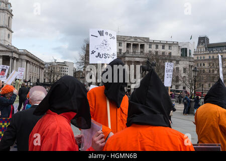 London, UK. 11th January 2017. The London Guantanamo Campaign holds the vigil in Trafalgar Square on the 15th anniversary of the US military prison camp opening at Guantanamo Bay. The campaigners mark the day with 'Sad Clown Protest' and demanded final closure of the 'war on terror' facility associated with human rights violations. Around 50 detainees are still being kept in Guantanamo Bay camp. Wiktor Szymanowicz/Alamy Live News Stock Photo