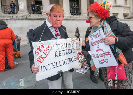 London, UK. 11th January 2017. A campaigner talks to 'President Trump' at the proester on the 15th anniversary of the setting up of the illegal prison camp at Guantanamo,the world before being illegally rendered to Guantanamo. Credit: Peter Marshall/Alamy Live News Stock Photo