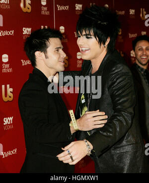 Kris Allen, left,  and Adam Lambert hug at the Us Weekly Hot Hollywood issue party in West Hollywood, California on November 19, 2009. Photo by Francis Specker Stock Photo