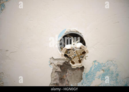 Damaged plug of abandoned building. Stock Photo