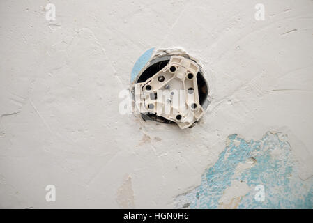 Damaged plug of abandoned building. Stock Photo