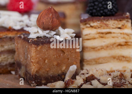 Very tasty chocolate cake on a wooden base , selective focus and small depth of field Stock Photo