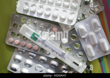 pills and thermometer  anti flu and cold Stock Photo