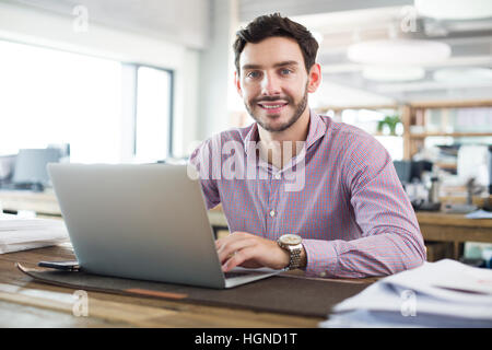Male architect working with laptop in the office Stock Photo