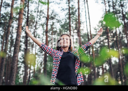 Young woman embracing the natural world around her Stock Photo