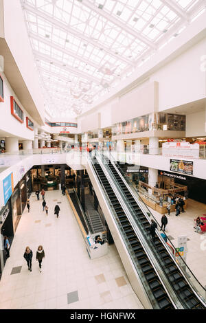 Minsk, Belarus - November 04, 2016: People in motion in escalators at the modern shopping mall ARENA City Stock Photo