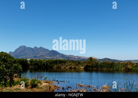 The dam, Bushes and Mountain View with Blue Skies. Stock Photo