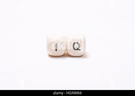 The word "IQ" on the white wooden cubes.  The concept of the mind, the intellect Stock Photo
