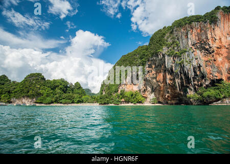 Tropical landscape with rock islands, lonely boat and crystal clear at Phi Phi island, Krabi Stock Photo