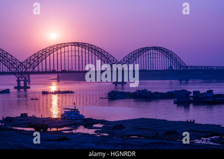 Yadanarbon bridge at sunset over Ayeyarwady River, Modern bridge in Mandalay division, Burma Stock Photo