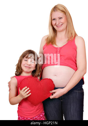 daughter and pregnant mother with big red heart Stock Photo