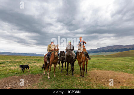 Kazakh nomadic horsemen in the Assy Plateau in Kazakhstan. Stock Photo