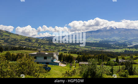 Old poor house and stunning landscape near Cotopaxi Volcano in Ecuador Stock Photo