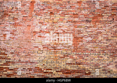 Weathered old brick wall exterior on a building in Winslow, Arizona Stock Photo