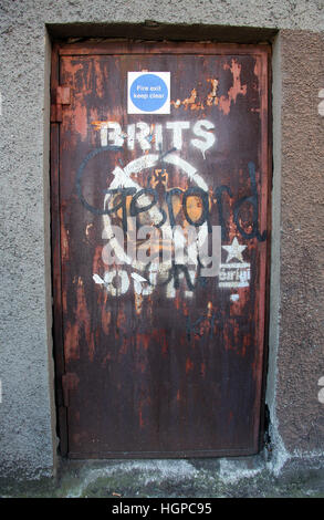 Brits Out painted on a Falls Road door in Belfast Stock Photo
