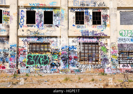 Old abandoned South Fremantle Power Station with youth tagging, broken windows and empty shell in North Coogee,Western Australia Stock Photo