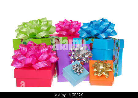 Many brightly colored boxes presents with colorful bows. Holiday shopping wrapped. Isolated on a white background. Stock Photo