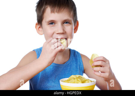 Little boy eating potato chips isolated white Stock Photo