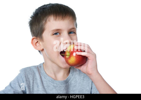Happy healthy boy eating apple isolated white Stock Photo