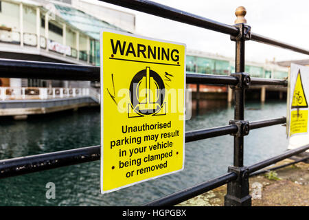 Car clamping sign warning sign vehicle will be clamped no parking zone restriction threat UK England Stock Photo