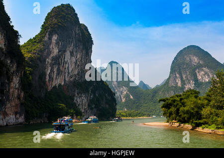 Passenger boats and rafts in the Li River in the Guagxi Region in China; Concept for travel in China Stock Photo