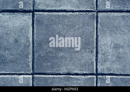 Concrete paving texture, top view of tiled gray square shaped slabs Stock Photo