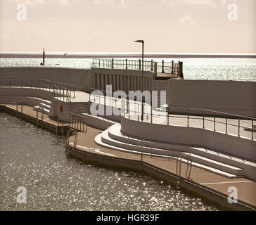 Subdued evening light (sepia-toned) over the Art Deco Jubilee Pool, Penzance, Cornwall, England, UK. Stock Photo