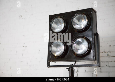 Spotlights in studio with wall Stock Photo