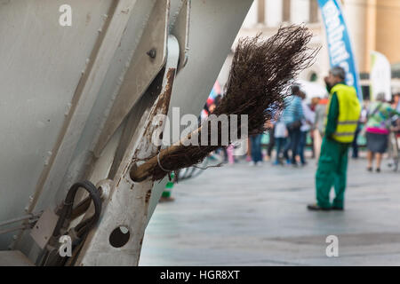 Municipal Dustman Worker with Cleaning Tools in Public Streets Stock Photo