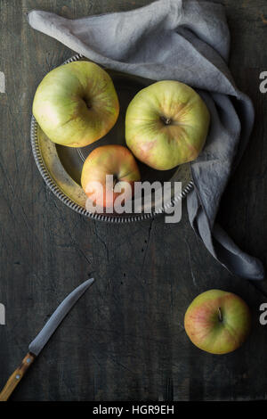 Apples on the dark scratched table Stock Photo
